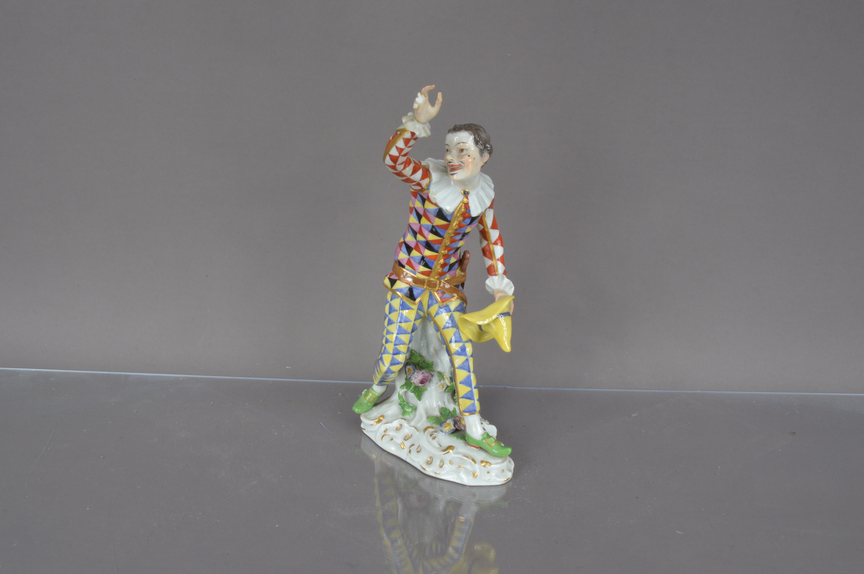 Lot 373 - An early 20th century Meissen porcelain figure of Harlequin