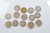 Fourteen commemorative £5 coins